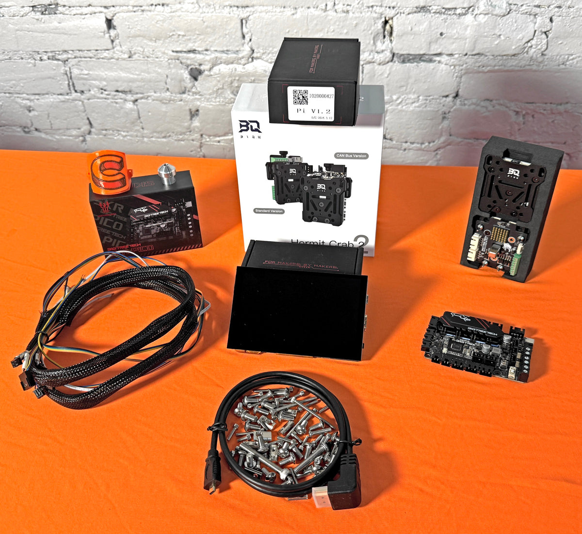 Cocoa Press upgrade kit components on an orange tabletop